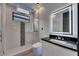 Modern bathroom with a glass shower, sleek vanity, and integrated lighting in the mirror at 6528 Simone Shores Cir, Apollo Beach, FL 33572