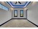 Contemporary bedroom with plush carpet, modern lighting, and serene neighborhood views at 6528 Simone Shores Cir, Apollo Beach, FL 33572