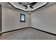 Empty carpeted bedroom with custom trim and picture window at 6528 Simone Shores Cir, Apollo Beach, FL 33572