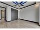 Bright bedroom with tiled floor, ceiling fan, recessed lighting, and closet with paneled doors at 6528 Simone Shores Cir, Apollo Beach, FL 33572