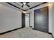 Bedroom features custom trim, modern ceiling fan, and large closet at 6528 Simone Shores Cir, Apollo Beach, FL 33572