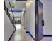 Bright entryway features modern stairwell, sleek flooring, and stylish front door at 6528 Simone Shores Cir, Apollo Beach, FL 33572