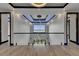 Elegant foyer featuring modern lighting, glass railings, and bright open space with views at 6528 Simone Shores Cir, Apollo Beach, FL 33572