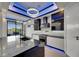 Modern kitchen featuring a large island, stainless steel appliances, and access to the outdoor patio at 6528 Simone Shores Cir, Apollo Beach, FL 33572