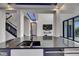 Modern kitchen with a black countertop, stylish sink, and seamless indoor-outdoor living at 6528 Simone Shores Cir, Apollo Beach, FL 33572