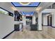 Sleek, modern kitchen with high-end appliances, a stylish island, and an open floor plan at 6528 Simone Shores Cir, Apollo Beach, FL 33572