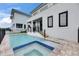 Backyard pool and patio with a modern home design at 6528 Simone Shores Cir, Apollo Beach, FL 33572