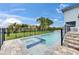 Backyard swimming pool and hot tub with a fenced in yard for privacy and steps to the main house at 6528 Simone Shores Cir, Apollo Beach, FL 33572