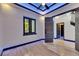 Room with wood-look tile floors, ceiling fan and recessed lights with blue accent lighting at 6528 Simone Shores Cir, Apollo Beach, FL 33572