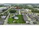 Aerial view of the neighborhood showcasing the community pool, playground, and surrounding homes at 6658 Devlin Ln, Wesley Chapel, FL 33545