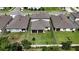 Aerial view of a home's backyard featuring a manicured lawn and fenced perimeter at 6658 Devlin Ln, Wesley Chapel, FL 33545