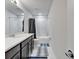 Modern bathroom featuring a vanity with dark wood cabinets, a white countertop, a toilet, and a shower-tub combination at 6658 Devlin Ln, Wesley Chapel, FL 33545