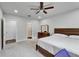 The bedroom boasts carpeted floors, recessed lights, and a bathroom en-suite at 6658 Devlin Ln, Wesley Chapel, FL 33545