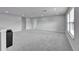 Spacious bonus room with plush carpeting, recessed lighting, and ample space for entertaining at 6658 Devlin Ln, Wesley Chapel, FL 33545
