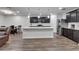 Bright kitchen with quartz island, stainless steel appliances, and modern pendant lighting at 6658 Devlin Ln, Wesley Chapel, FL 33545