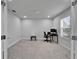 Bright home office with gray carpet, natural light, and neutral paint at 6658 Devlin Ln, Wesley Chapel, FL 33545