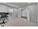 Carpeted office space filled with natural light from a large window at 6658 Devlin Ln, Wesley Chapel, FL 33545