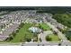 Aerial view showcases the community pool featuring cabanas and a splash pad at 6658 Devlin Ln, Wesley Chapel, FL 33545