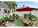 Charming backyard featuring an umbrella-covered seating area at 675 64Th S Ave, St Petersburg, FL 33705