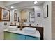 Elegant bathroom featuring double vessel sinks, modern fixtures, and a sleek vanity at 675 64Th S Ave, St Petersburg, FL 33705