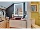 Modern bathroom featuring a wood countertop, vessel sink, and walk-in closet at 675 64Th S Ave, St Petersburg, FL 33705