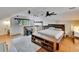Bedroom with sloped ceiling, wood floor, ceiling fan, and lofted space above stairs at 675 64Th S Ave, St Petersburg, FL 33705