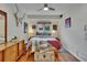 Cozy bedroom featuring a bed, mid-century modern decor, natural light, and a modern ceiling fan at 675 64Th S Ave, St Petersburg, FL 33705