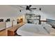 Cozy bedroom with a ceiling fan, wood floors, and stairs to a loft at 675 64Th S Ave, St Petersburg, FL 33705