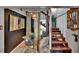 Charming dining area featuring modern seating, unique decor, and adjacent stairway to upper level at 675 64Th S Ave, St Petersburg, FL 33705