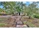 Charming home featuring a colorful stone walkway leading to a welcoming front porch at 675 64Th S Ave, St Petersburg, FL 33705