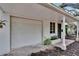 Home exterior showing the garage and neat landscaping at 675 64Th S Ave, St Petersburg, FL 33705