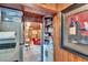 Hallway that provides a view of the living room and kitchen at 675 64Th S Ave, St Petersburg, FL 33705