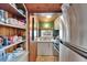 Efficient kitchen layout with stainless steel appliances, white cabinets, and ample storage at 675 64Th S Ave, St Petersburg, FL 33705