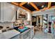 Stylish kitchen leading to dining area, featuring stainless steel appliances and ample counter space at 675 64Th S Ave, St Petersburg, FL 33705