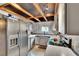 Bright kitchen featuring stainless steel appliances, white cabinets, and a unique ceiling design at 675 64Th S Ave, St Petersburg, FL 33705