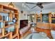 Bright living room featuring stylish decor, hardwood floors, plentiful windows, a wet bar, and custom shelving at 675 64Th S Ave, St Petersburg, FL 33705