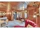 Cozy living room with wood paneling, desk area, and bar, perfect for relaxing and entertaining at 675 64Th S Ave, St Petersburg, FL 33705