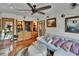 Open living room featuring a cozy seating area, hardwood floors, wet bar, and access to other areas at 675 64Th S Ave, St Petersburg, FL 33705