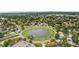Aerial view of pond surrounded by homes in a residential neighborhood at 6897 18Th N St, St Petersburg, FL 33702