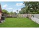 Spacious backyard with lush lawn and wood fence, perfect for entertaining at 6897 18Th N St, St Petersburg, FL 33702