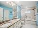Full bathroom with double sink vanity and shower/tub with tiled walls at 6897 18Th N St, St Petersburg, FL 33702