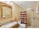Bathroom featuring a tiled shower, neutral walls, and a vanity with a granite countertop at 6897 18Th N St, St Petersburg, FL 33702