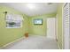 Bedroom featuring bright green walls and a mounted television at 6897 18Th N St, St Petersburg, FL 33702