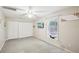 Light and airy bedroom with a ceiling fan, window, and plenty of storage at 6897 18Th N St, St Petersburg, FL 33702