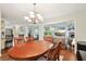 Dining room is open to the living room and kitchen areas of the home at 6897 18Th N St, St Petersburg, FL 33702