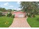 Charming single-story home featuring a two-car garage and a beautiful front yard at 6897 18Th N St, St Petersburg, FL 33702