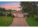 A well-maintained single-Gathering home with a brick driveway and a two-car garage at 6897 18Th N St, St Petersburg, FL 33702