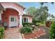 Inviting front entrance with manicured landscaping and a charming porch at 6897 18Th N St, St Petersburg, FL 33702