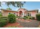 Charming single-story home boasting a beautifully landscaped front yard and inviting entrance at 6897 18Th N St, St Petersburg, FL 33702