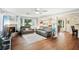 Spacious living room features a fireplace, hardwood floors, and neutral decor at 6897 18Th N St, St Petersburg, FL 33702